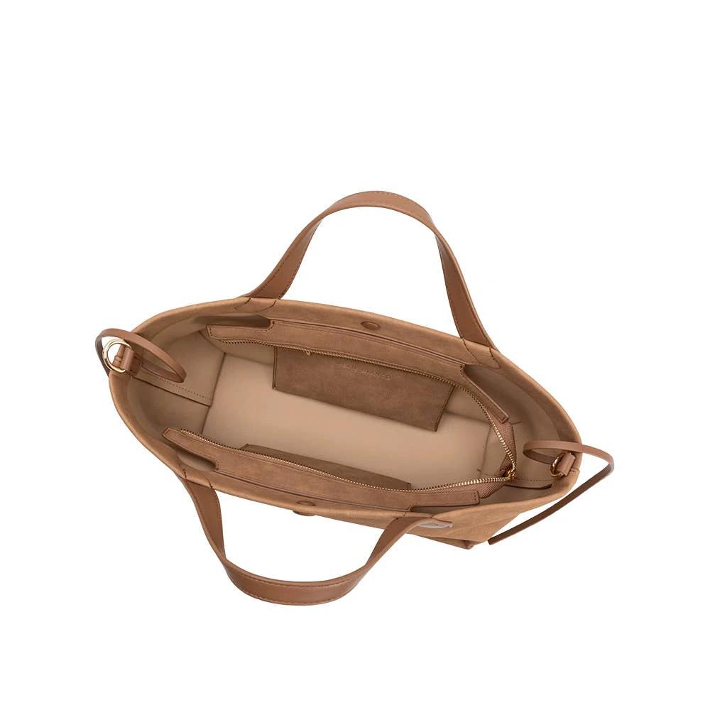 Tan suede vegan tote with two top handles, open beige-lined interior, zipper pocket, and interior slip pocket.