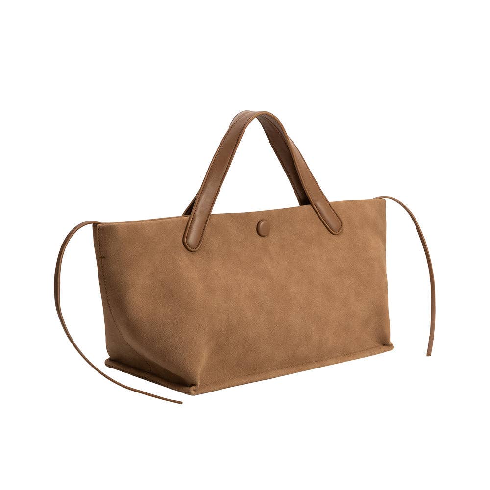 Tan recycled vegan suede tote with two short handles, long side ties, and a front snap closure.