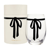 Cream gift box with a black bow and a clear stemless wine glass, both featuring a black ribbon bow.