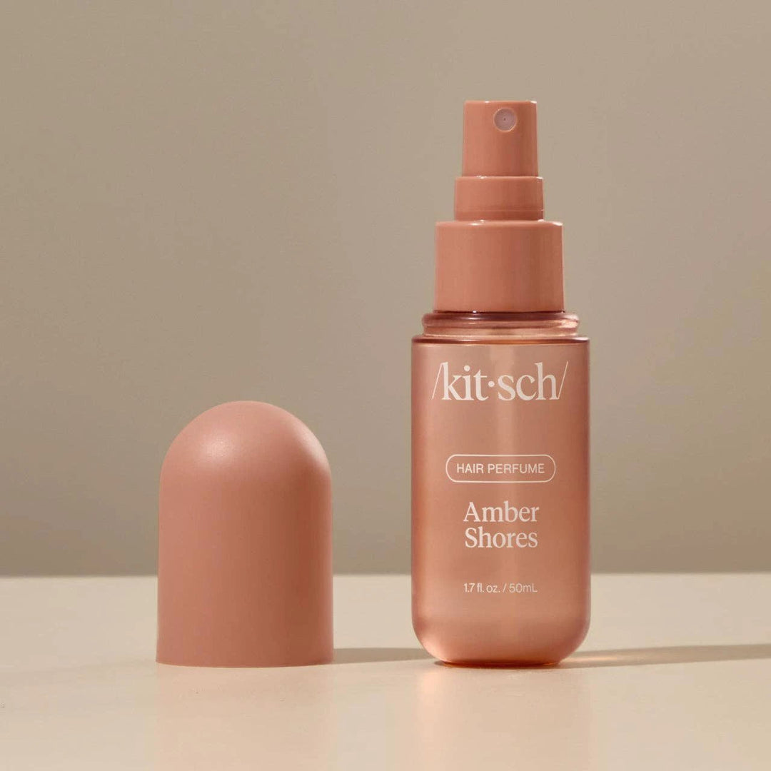 Amber Shores hair perfume by KITSCH in peach-pink bottle with spray nozzle
