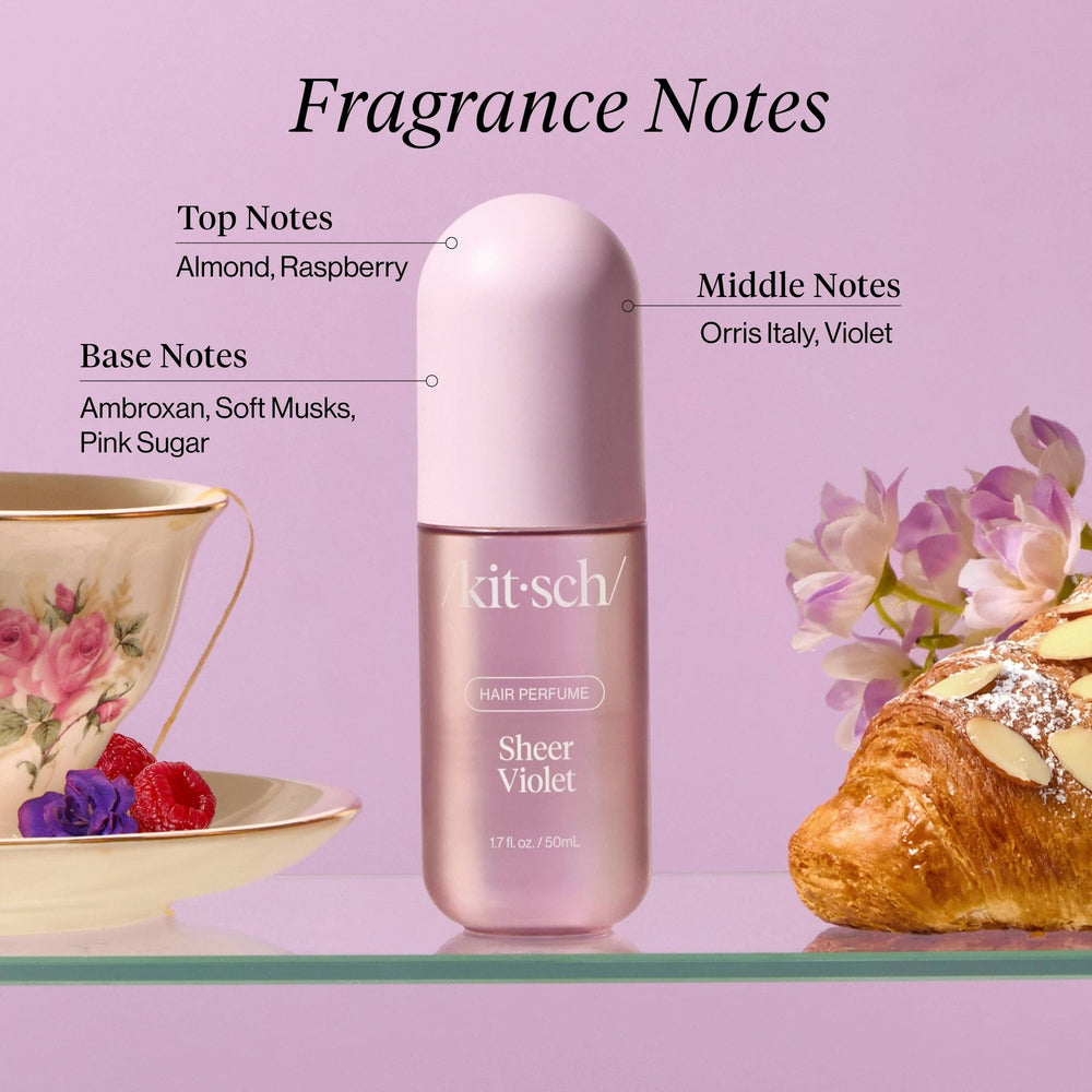 Sheer Violet Hair Perfume by KITSCH, pink metallic bottle with a rounded cap.