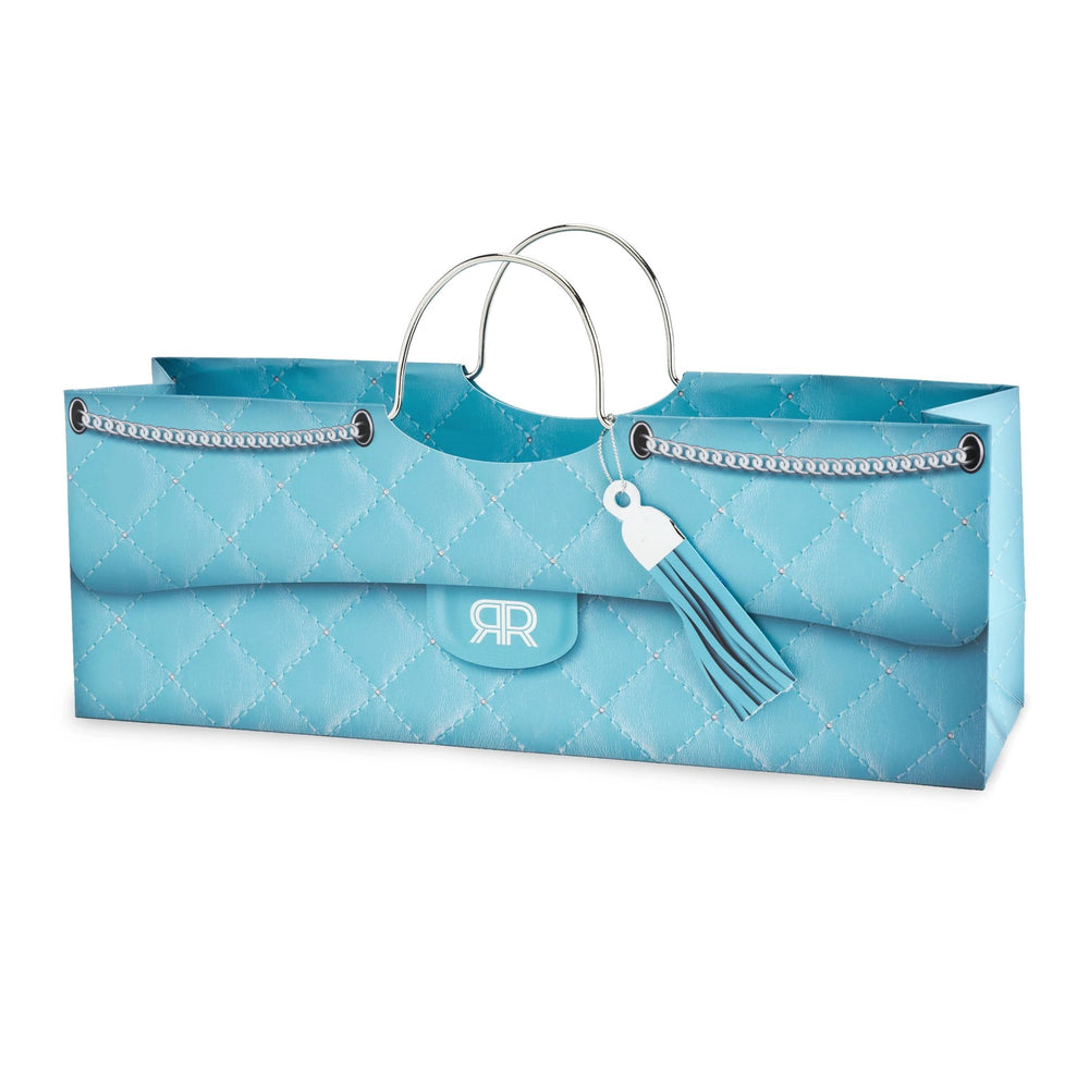 Turquoise quilted purse-shaped wine bag for a single bottle with silver handles, chain trim, and turquoise tassel charm.