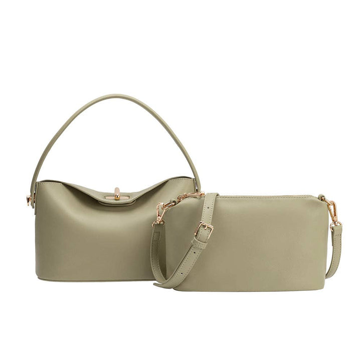 Sage-green recycled vegan leather bags: curved-top handheld bag and crossbody with adjustable strap, gold hardware.