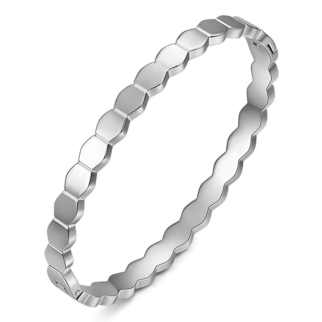Silver stainless steel bracelet with flat, beveled hexagonal links in a twisted-chain design and a hidden clasp.