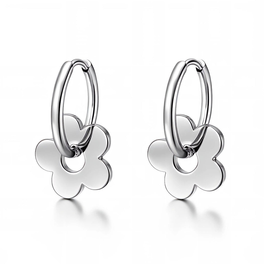 Pair of silver-tone stainless steel hoop earrings, each with a small flower-shaped charm hanging from the hoop.