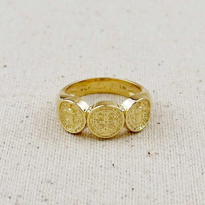 Gold-filled ring with three Saint Benedict medals on top; central larger medal flanked by two smaller ones.