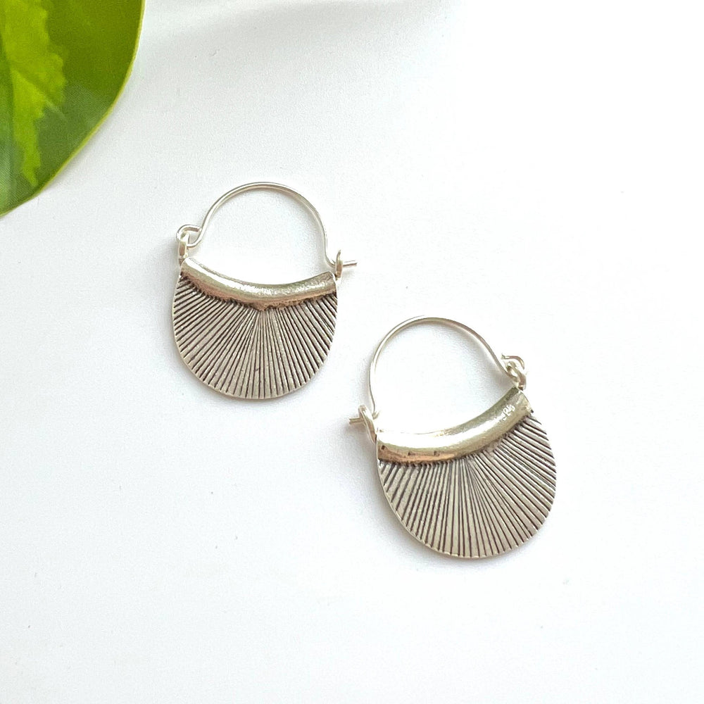 Sterling silver Hill Tribe etched petal earrings with radiating lines and curved hoop tops