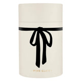 Cream cylindrical gift box featuring a bold black bow around the middle and gold 'WINE GLASS' text at the base.