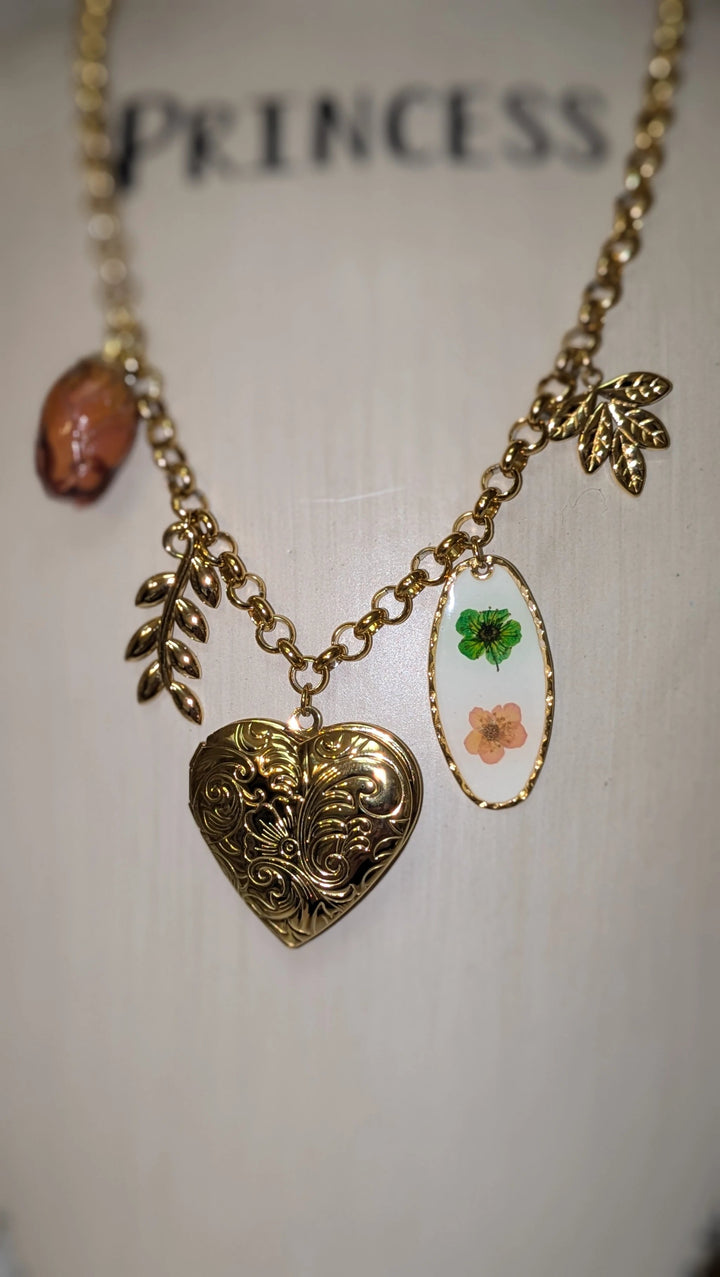 Lantana Necklace: 18K gold non-tarnish chain with four charms, vintage engraved heart locket and oval floral pendant