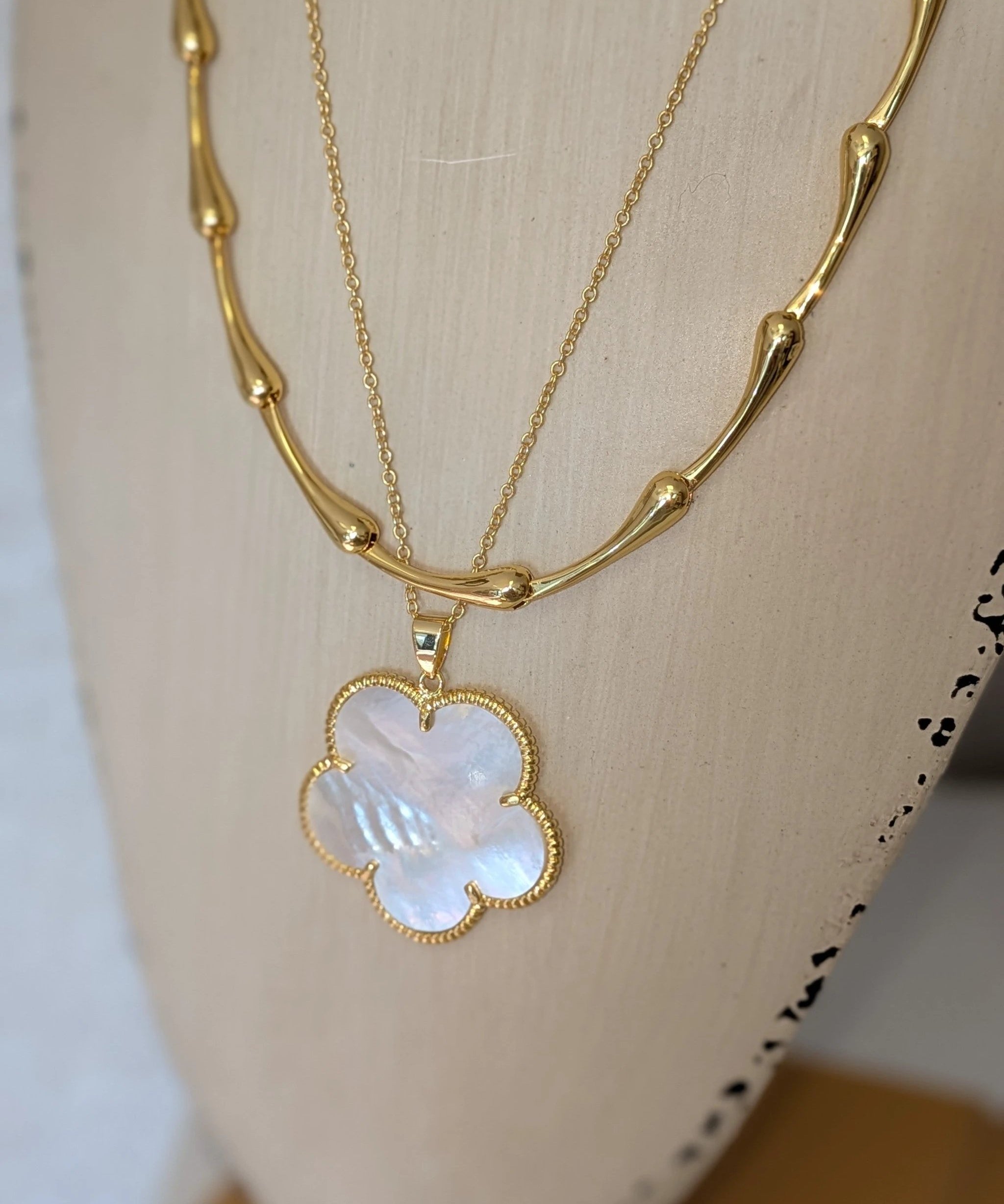 Victoria Necklace by Sahira Jewelry Design, gold-tone layered necklace with iridescent mother-of-pearl clover pendant