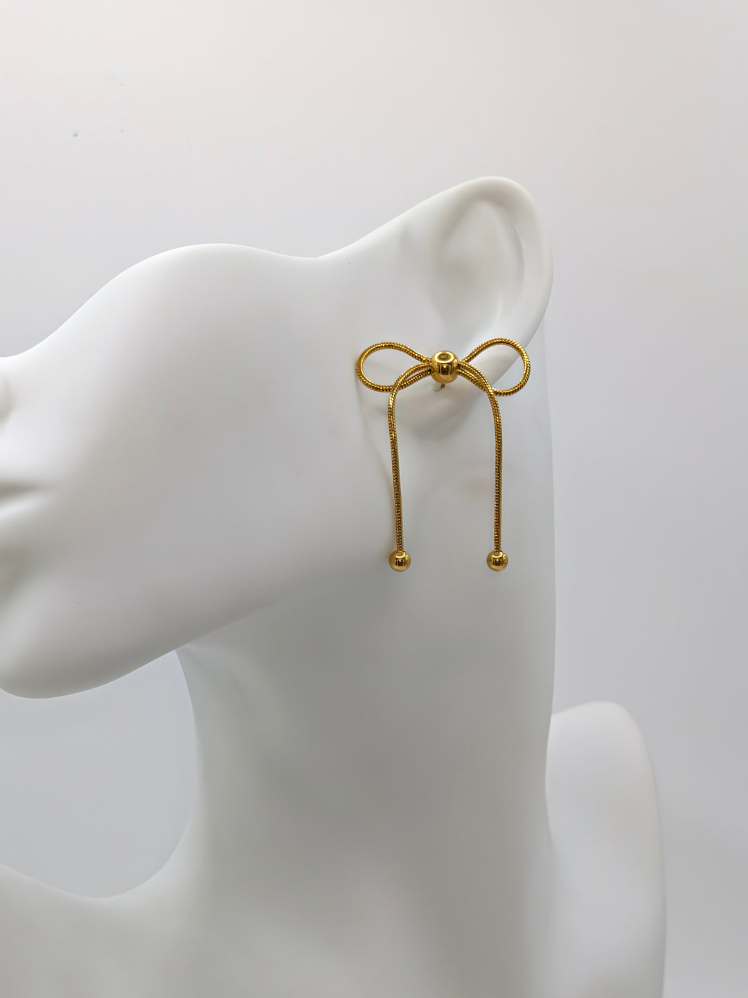 Gold Bow Dangle Earrings Nash Grey