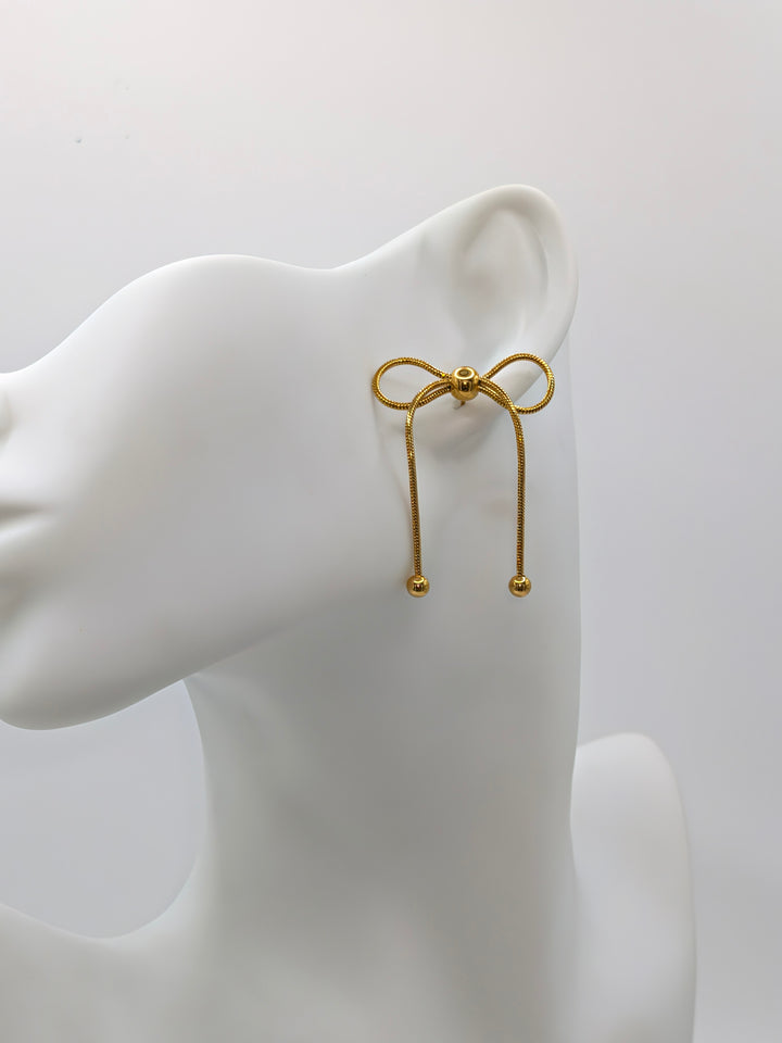 Gold Bow Dangle Earrings Nash Grey