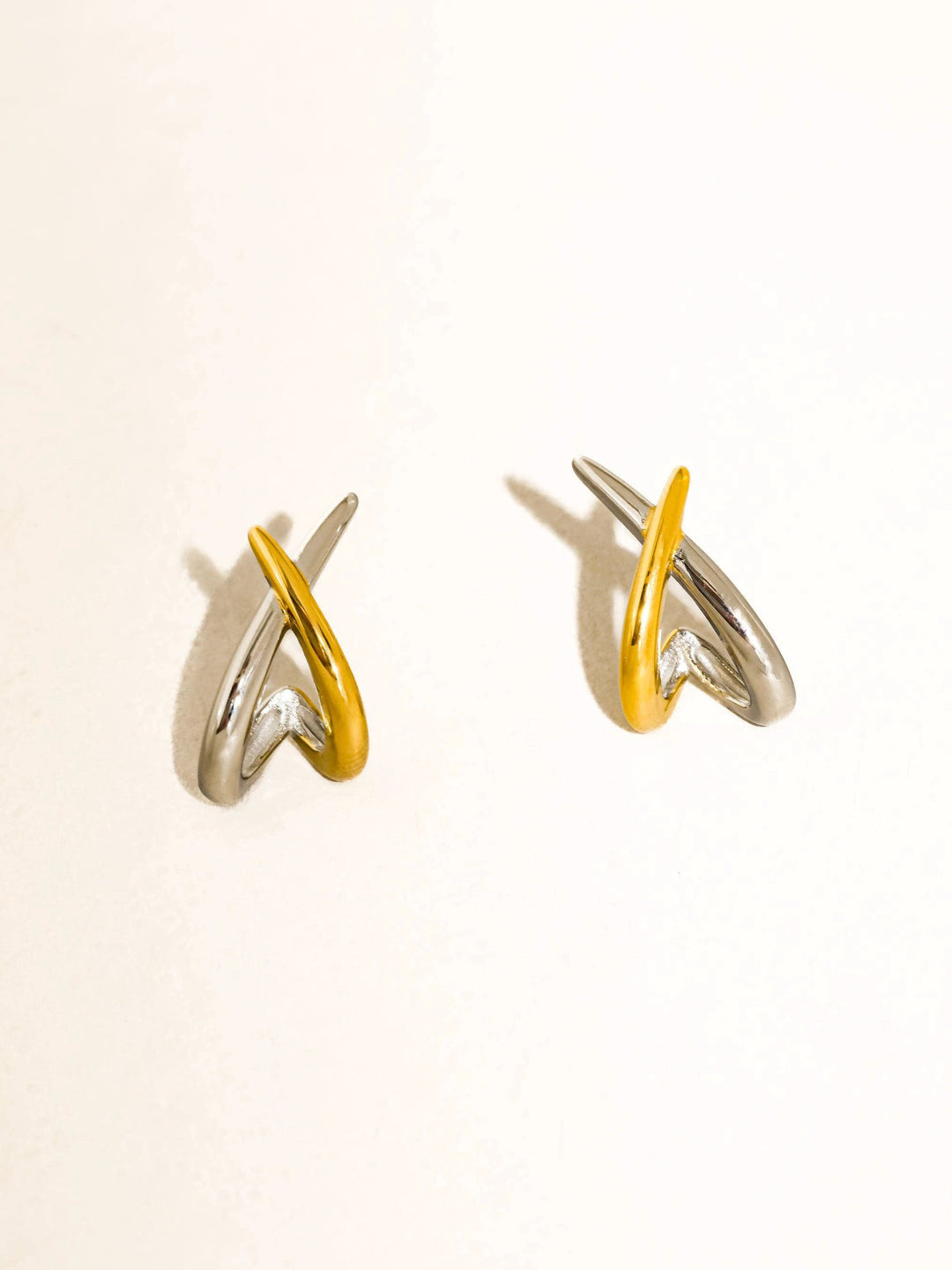 Staven 18K gold and silver-tone non-tarnish two-tone crossover earrings pair by Flânerie by MAIQ
