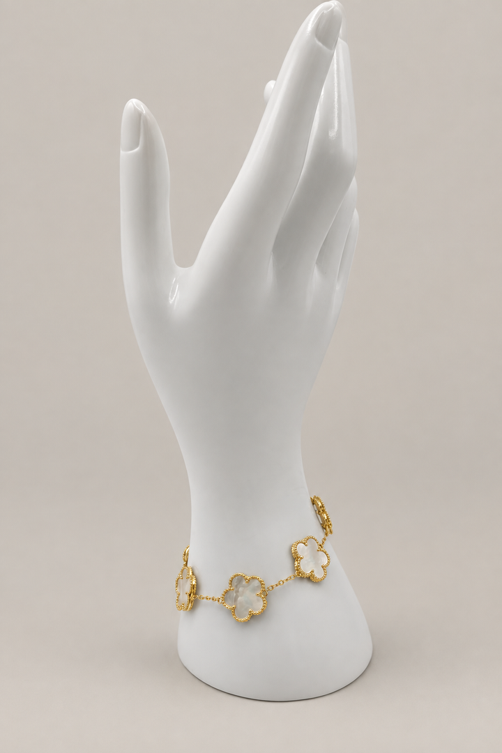 Adeline Clover Bracelet with a matching warm-gray background