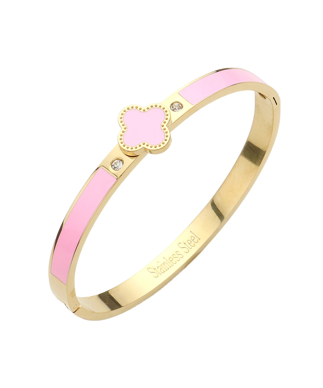 Gold-tone stainless steel bangle with pink enamel panels and a pink clover charm edged in gold, plus small crystals.
