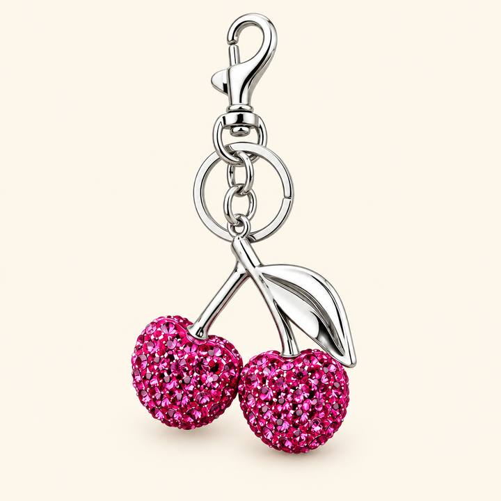 Cherry charm alone on an ivory background