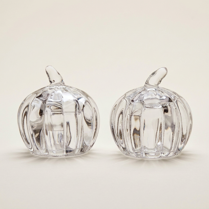 Crystal pumpkin shakers on a plain soft ivory background
