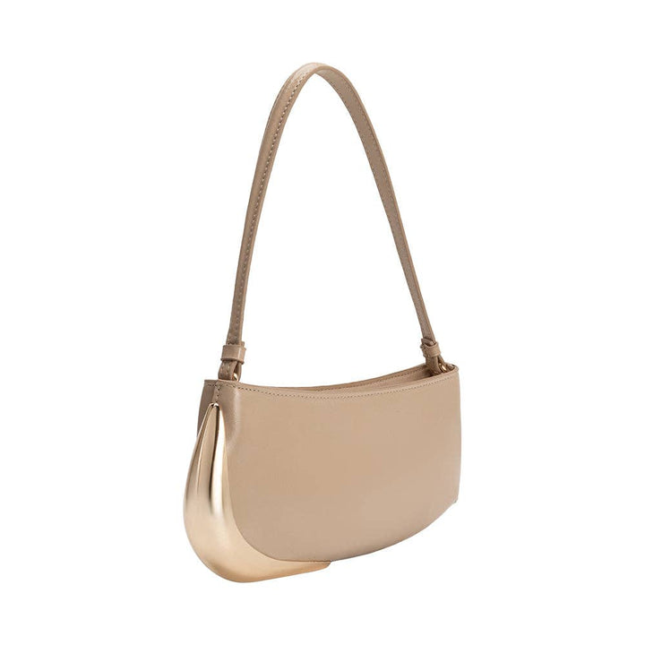 Beige recycled vegan leather shoulder bag with a gold-toned curved metal accent on the front and a single shoulder strap.