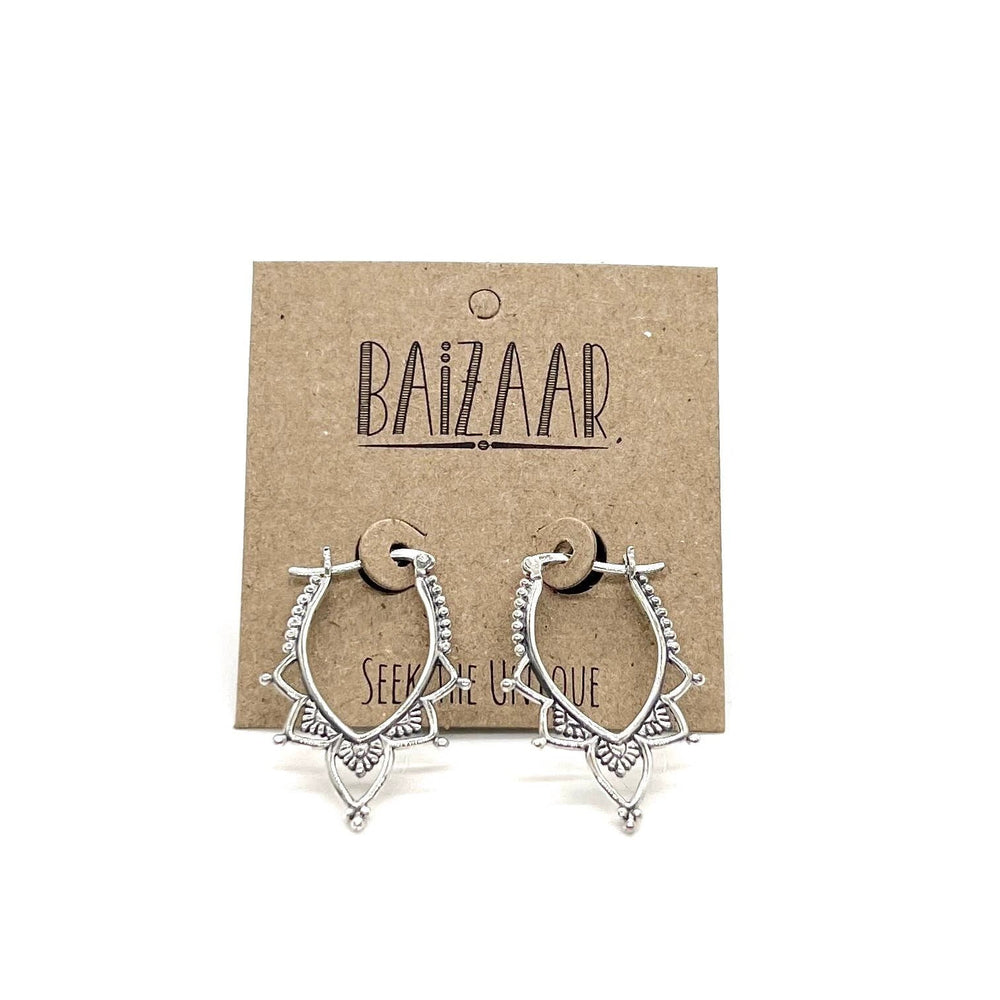 Pair of sterling silver lotus-inspired hoop earrings with beaded trim and petal accents on a brown kraft display card.