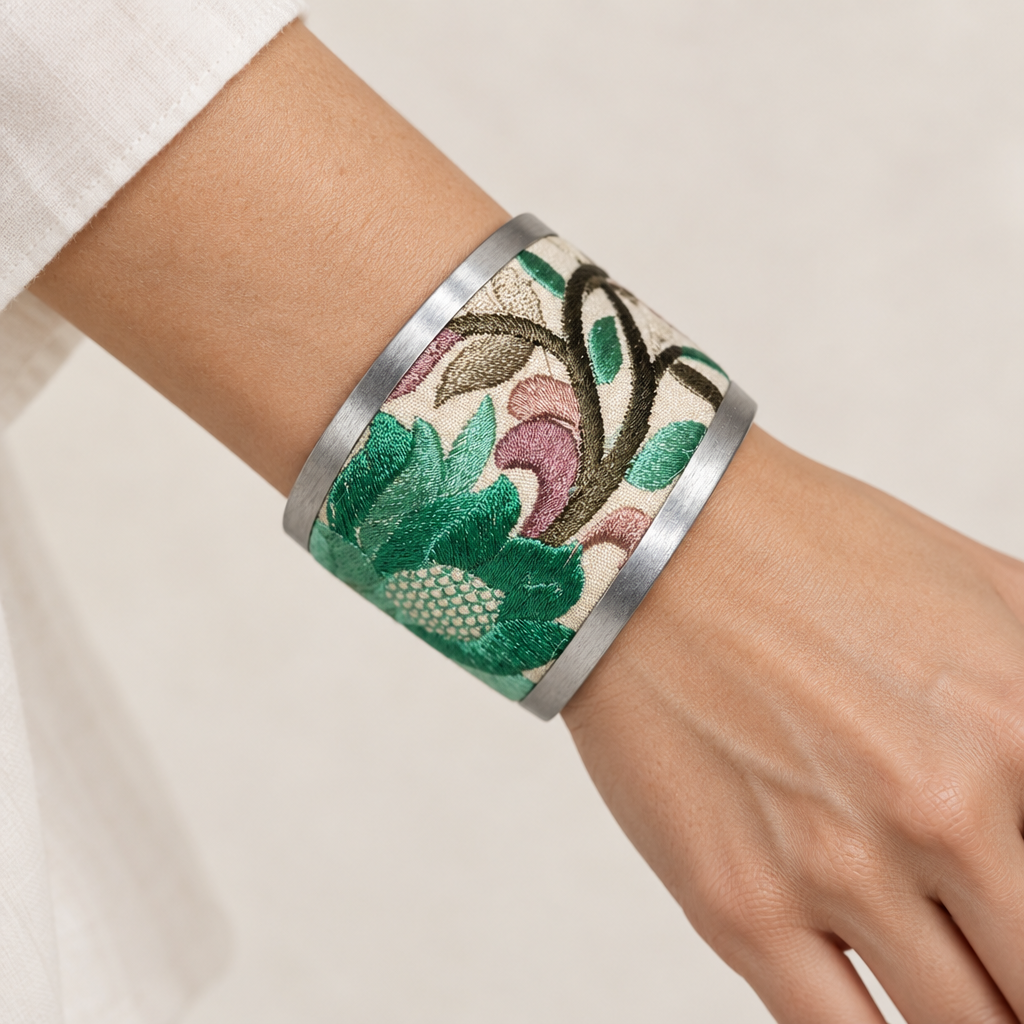 Embroidered cuff bracelet worn on a wrist