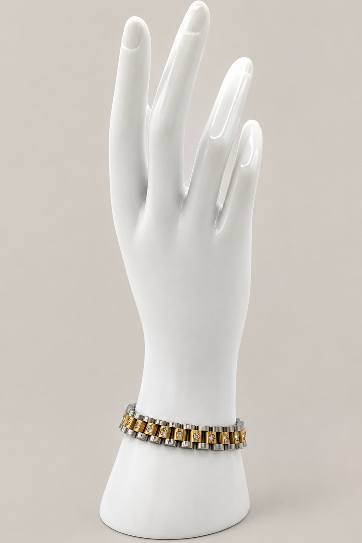 Faelys Two-Tone Watchband Bracelet with a matching warm-gray background