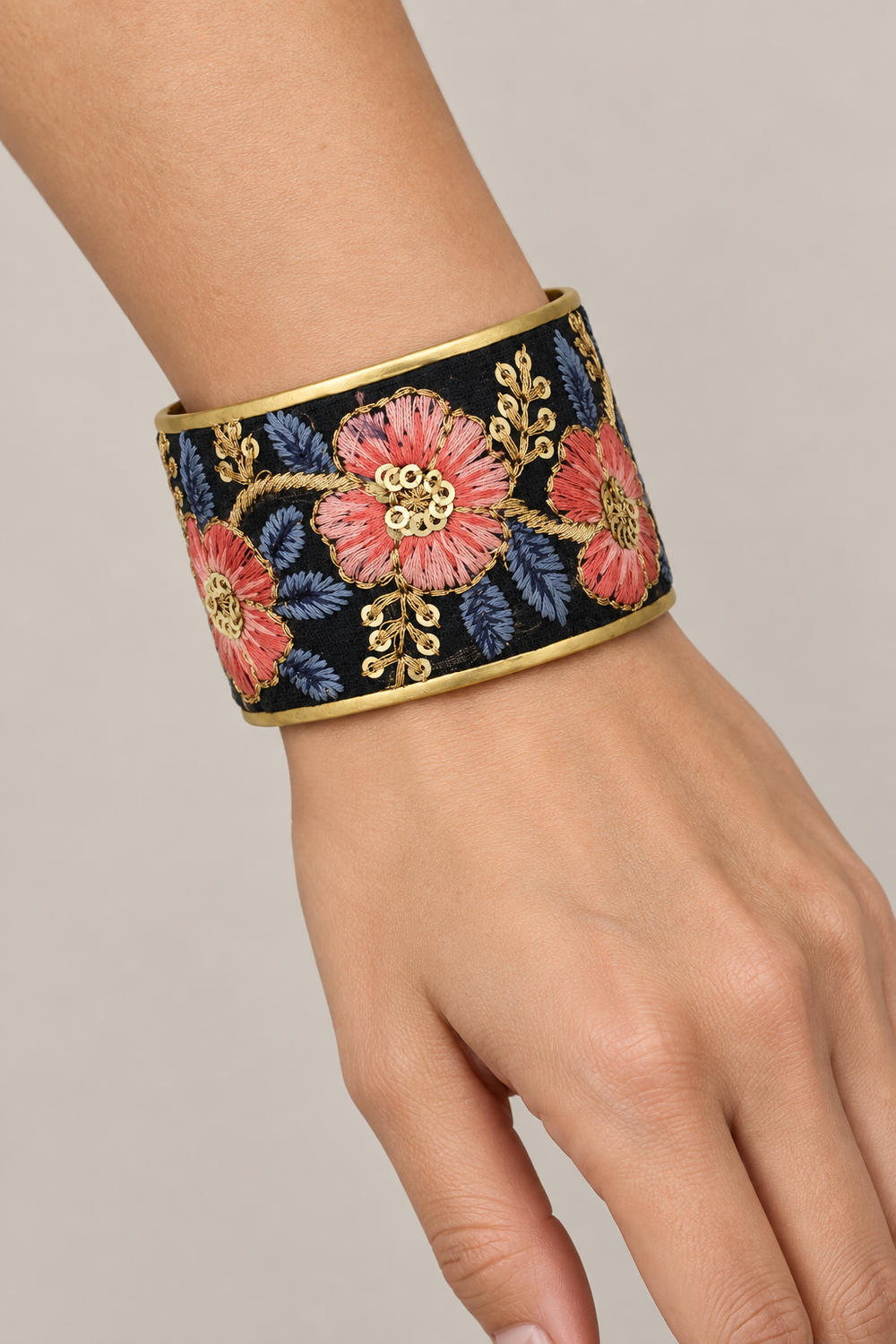 Floral embroidered cuff on a woman’s wrist