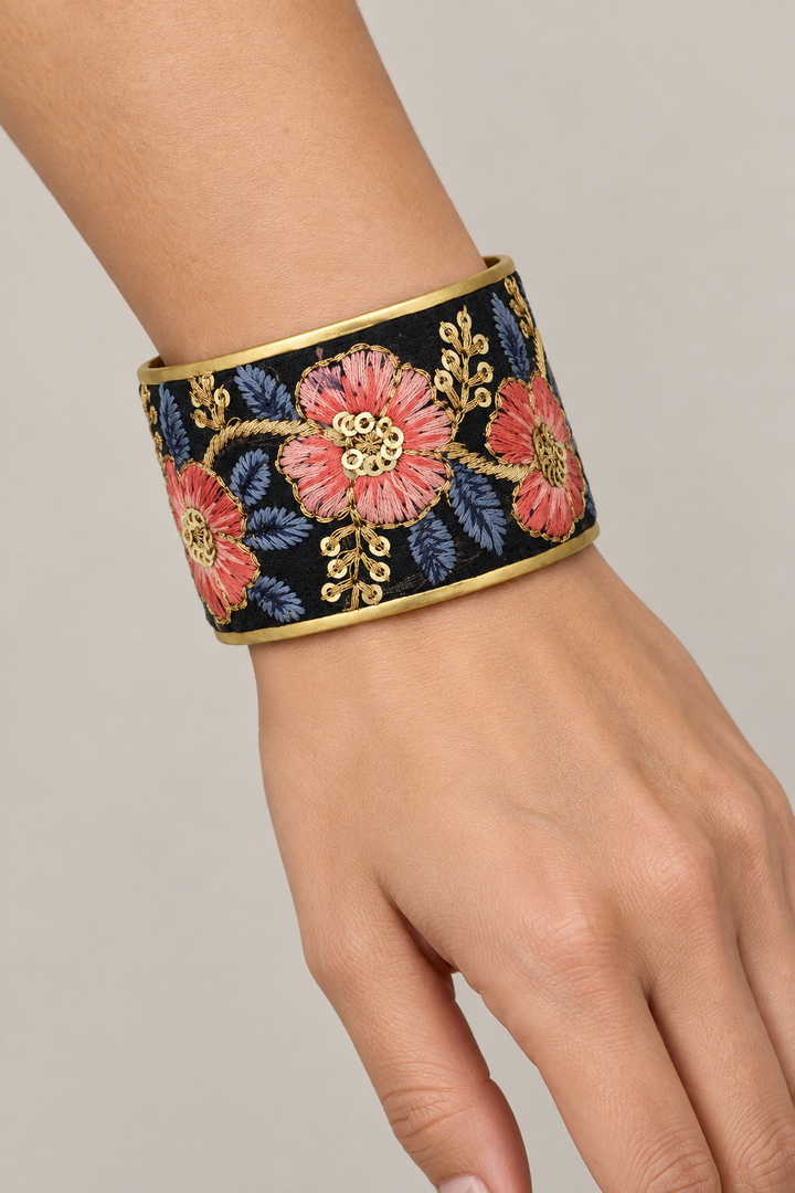 Floral embroidered cuff on a woman’s wrist