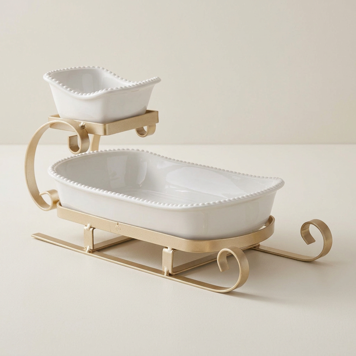 Gold sleigh two-tier server on a soft ivory background