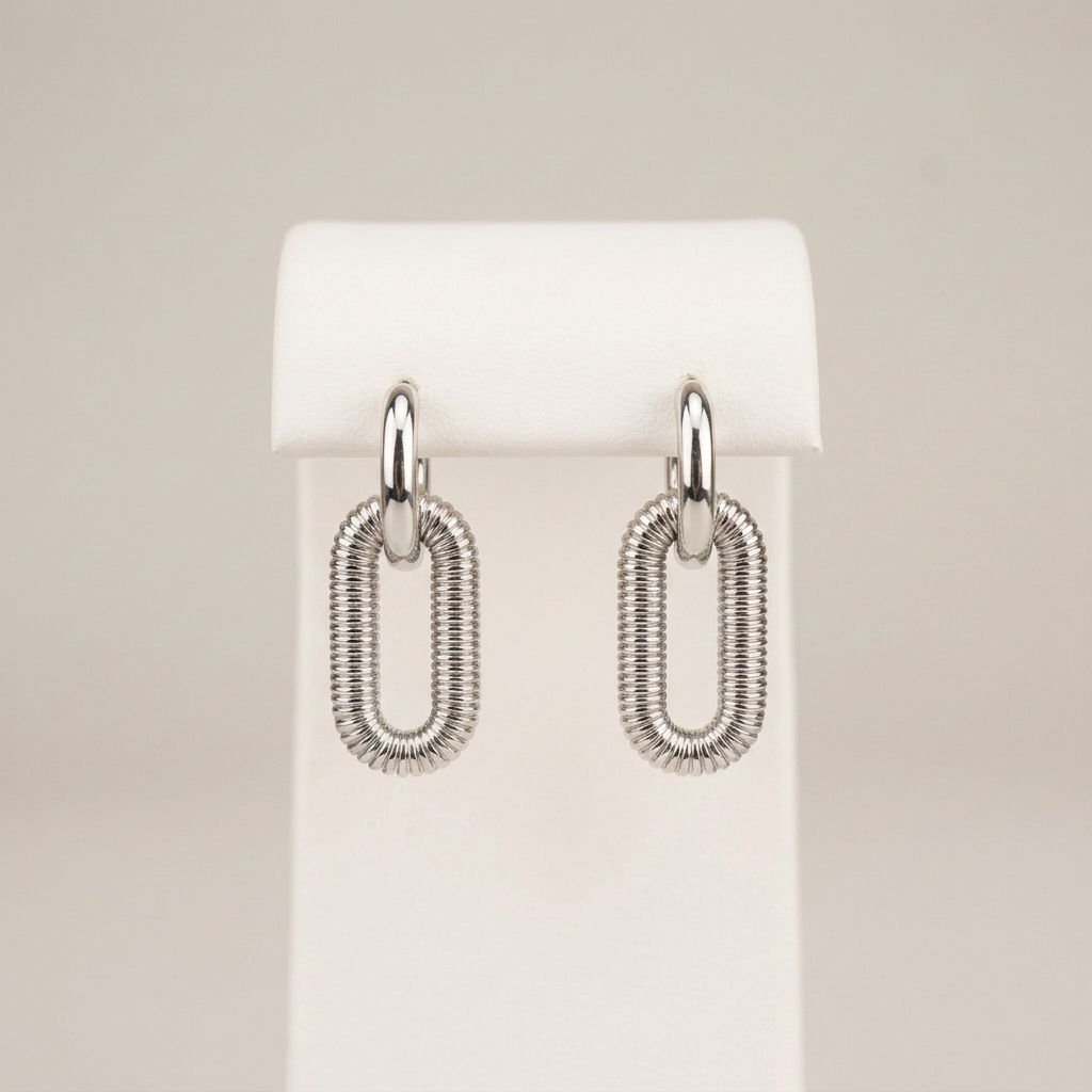 Kate earrings on the original matching white stand