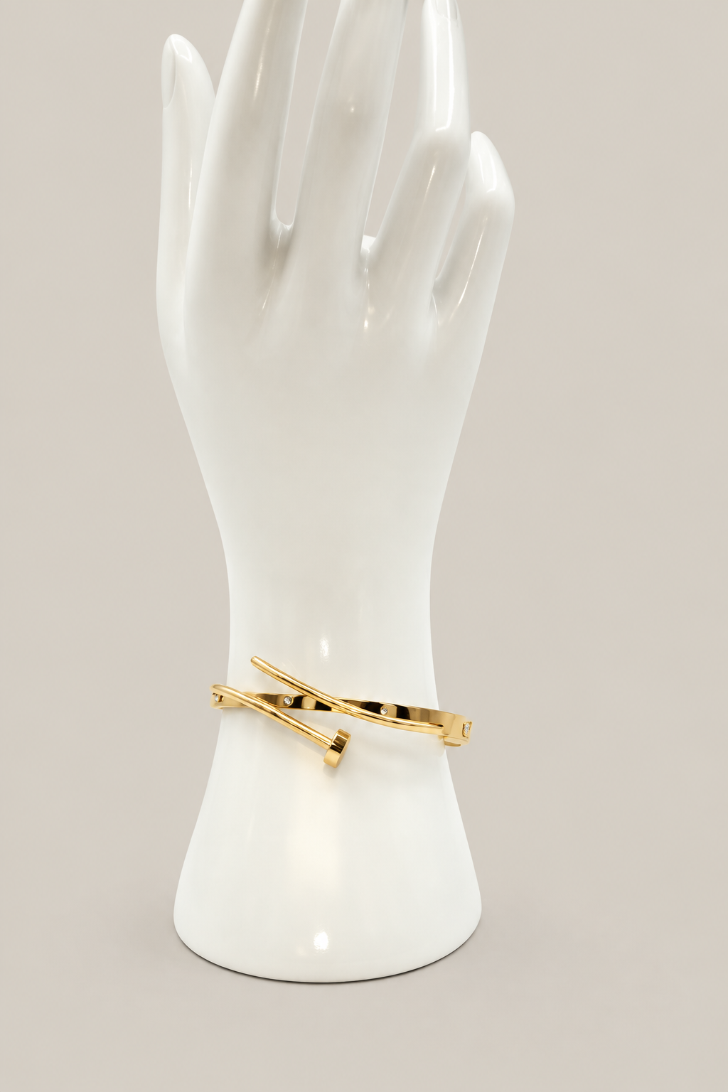 Kelsie Nail Bracelet with a matching warm-gray background