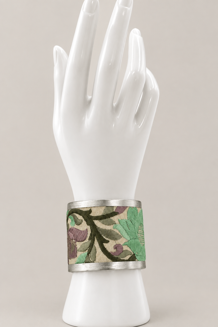 Latest main-photo cuff on an upright white hand