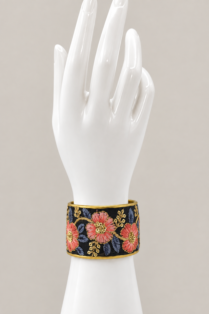 Main-photo embroidered cuff on an upright white hand