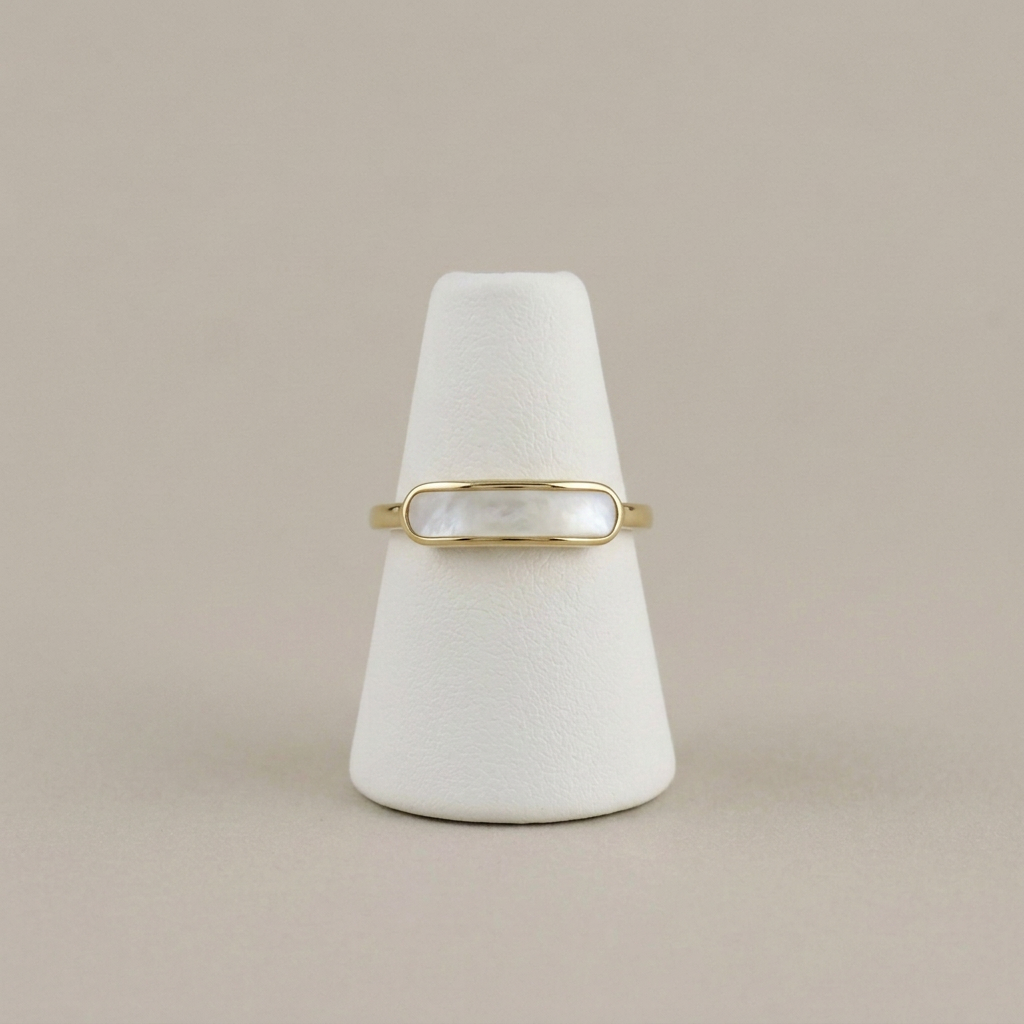 Mother of Pearl Ring on a white ring stand