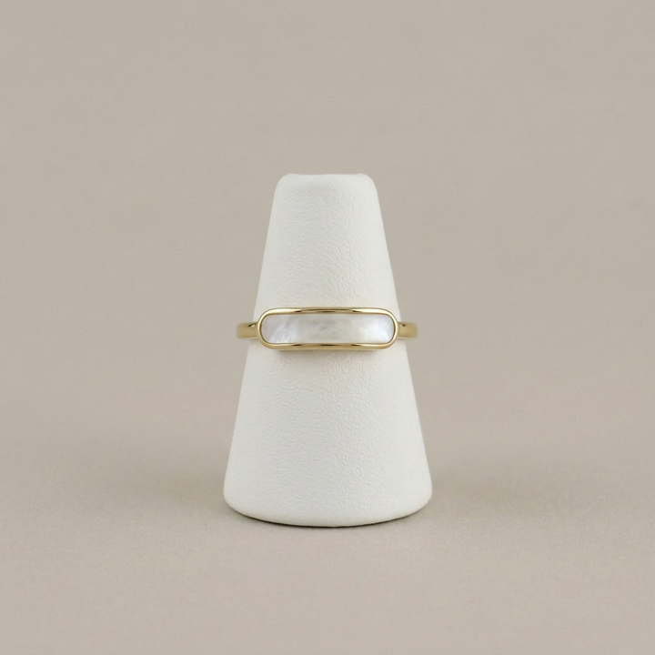 Mother of Pearl Ring on a white ring stand