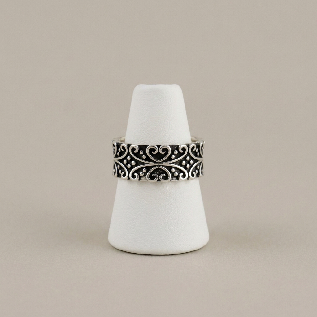 Oxidized silver band on the matching white cone stand