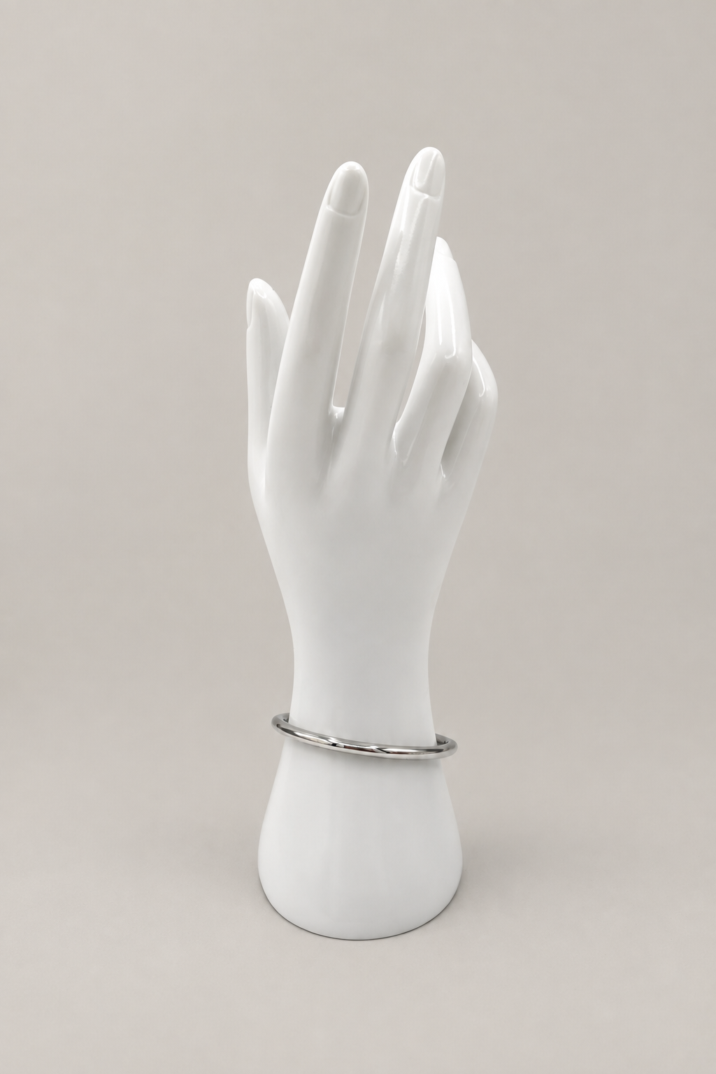 Paros Silver Bangle with a matching warm-gray background