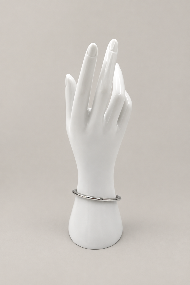Paros Silver Bangle with a matching warm-gray background