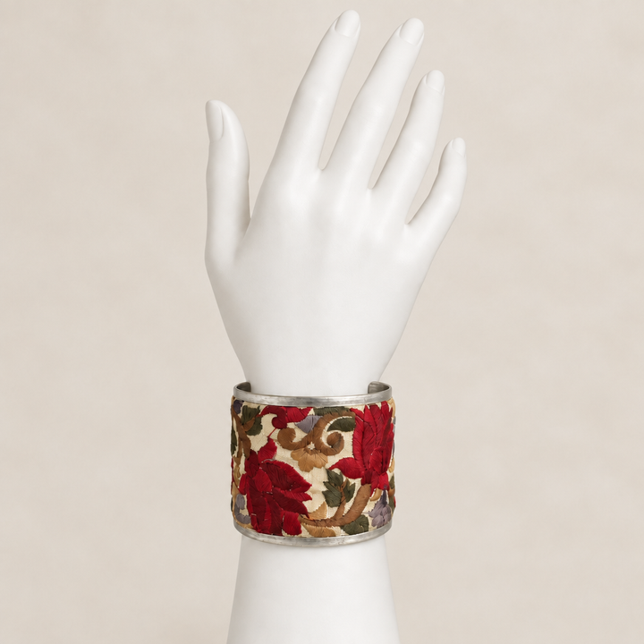 Red cuff on white display hand with matching background