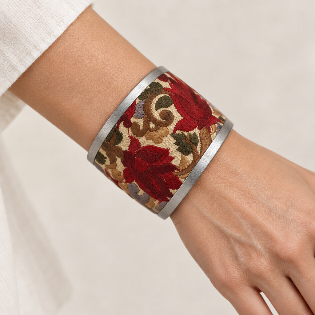 Red floral cuff worn on a wrist
