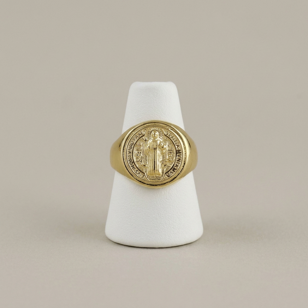 Saint Benedict ring on a white ring stand
