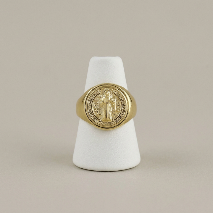 Saint Benedict ring on a white ring stand