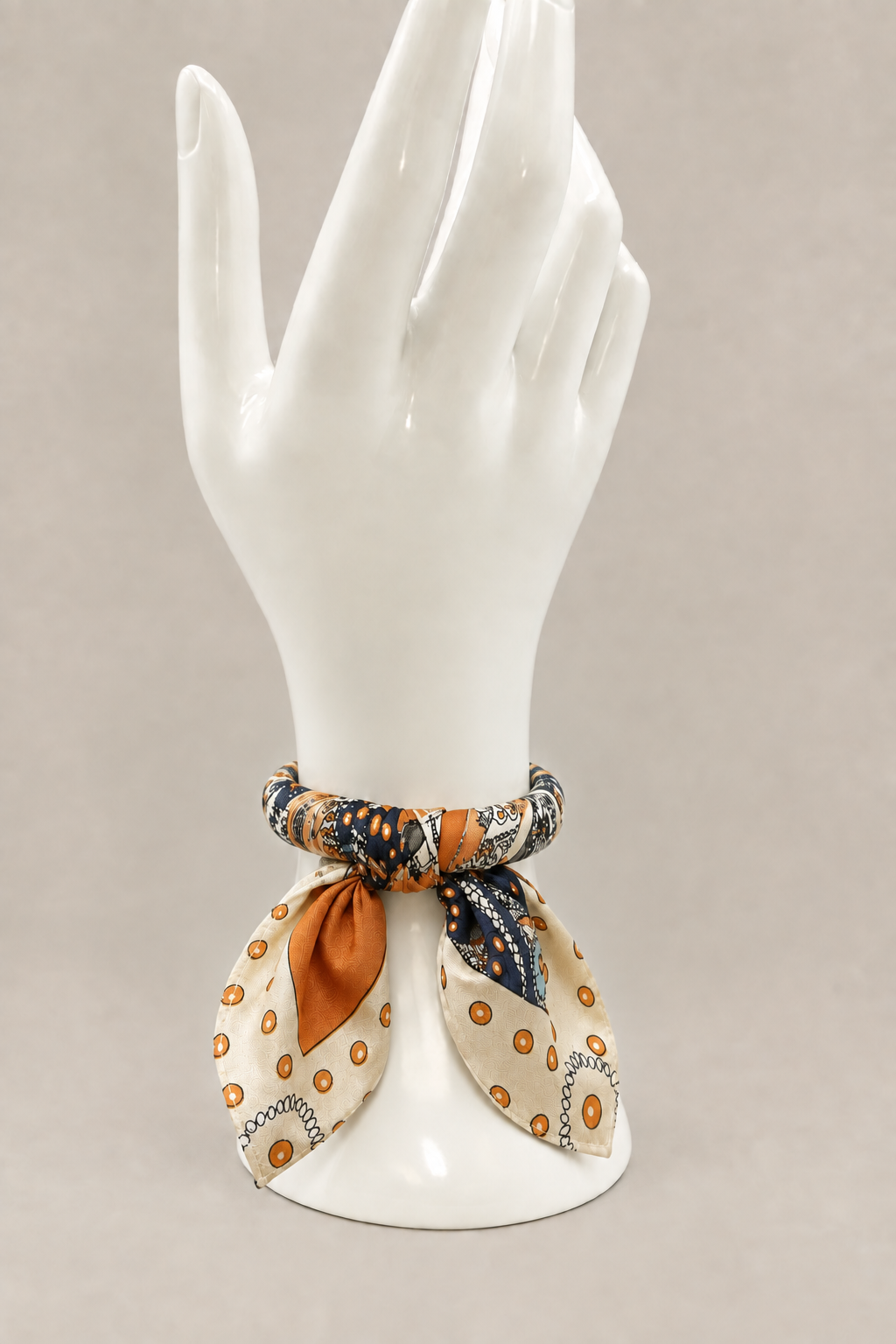 Scarf bangle lower near the display hand’s base