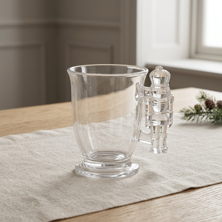 Single nutcracker crystal mug on an oak table with neutral linen and soft daylight