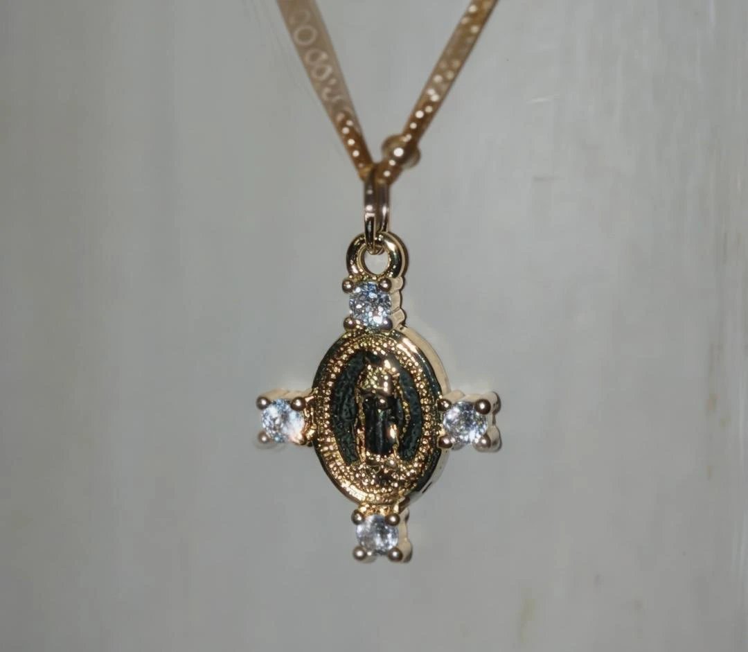 Camila Cross Necklace pendant, gold-tone with clear stones around an oval medallion by True by Kristy Jewelry.