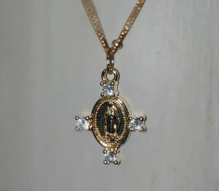 Camila Cross Necklace pendant, gold-tone with clear stones around an oval medallion by True by Kristy Jewelry.