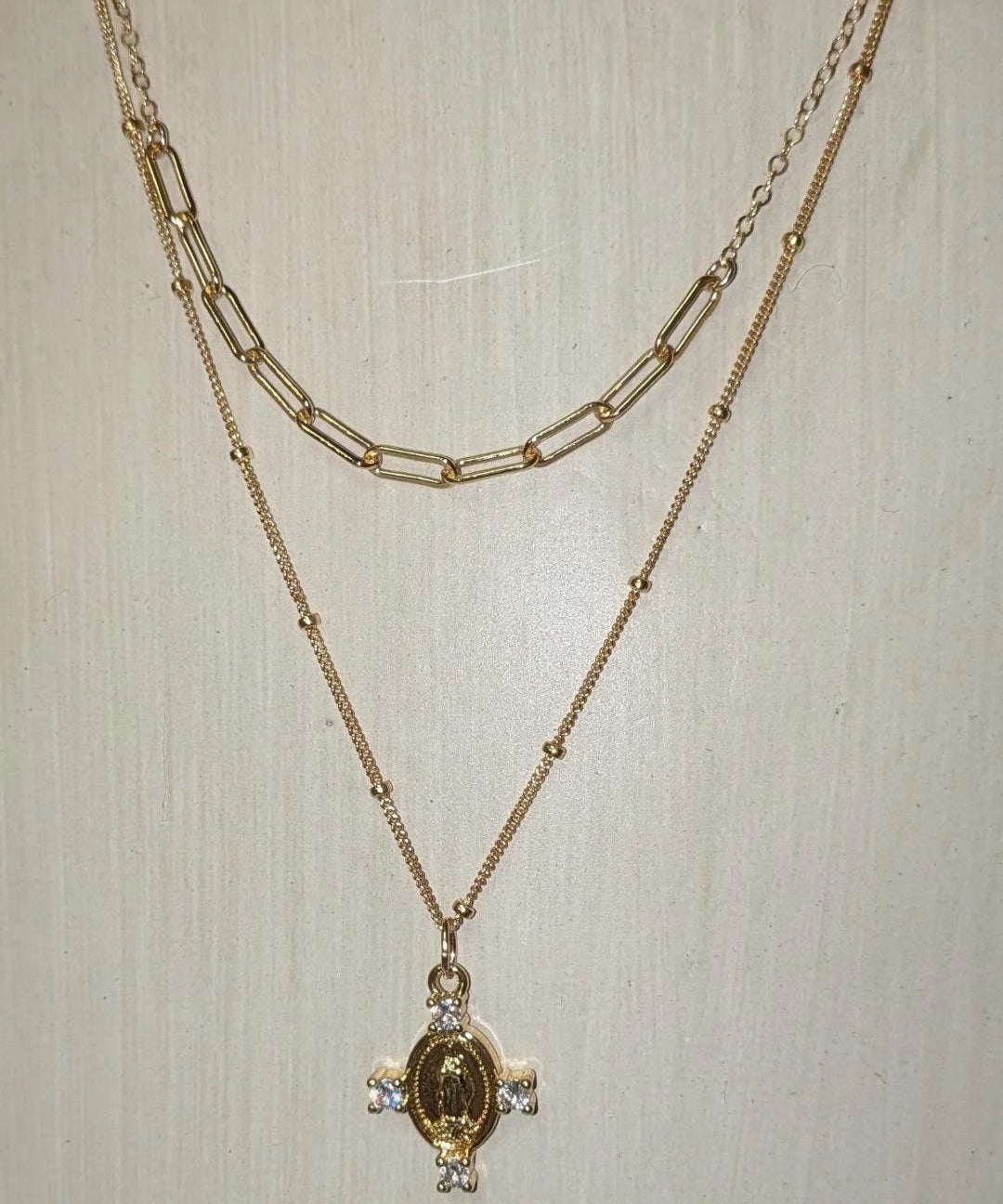 Camila Cross Necklace, gold-tone two-layer chain with a medallion pendant and crystal accents.