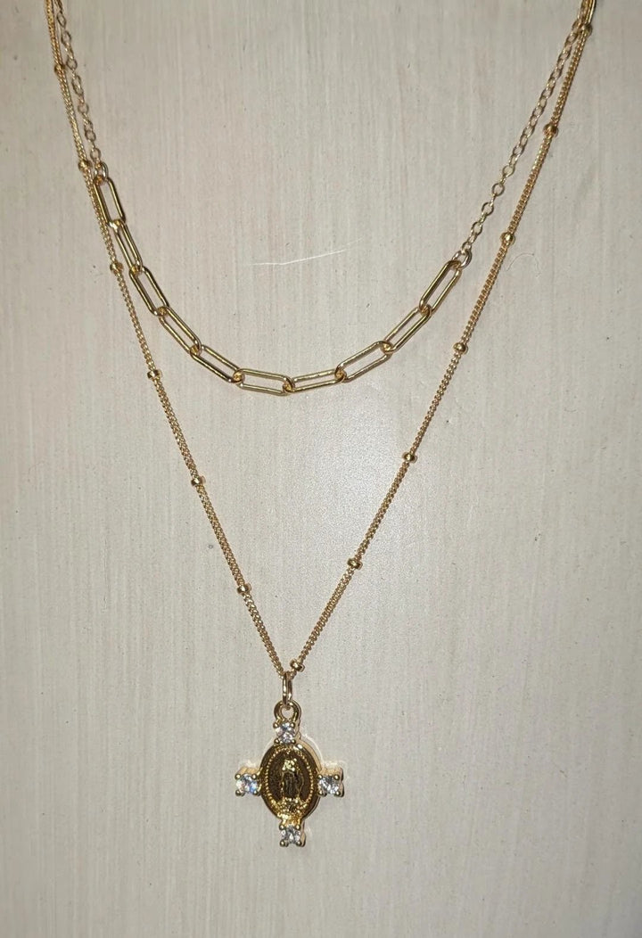 Camila Cross Necklace, gold-tone two-layer chain with a medallion pendant and crystal accents.