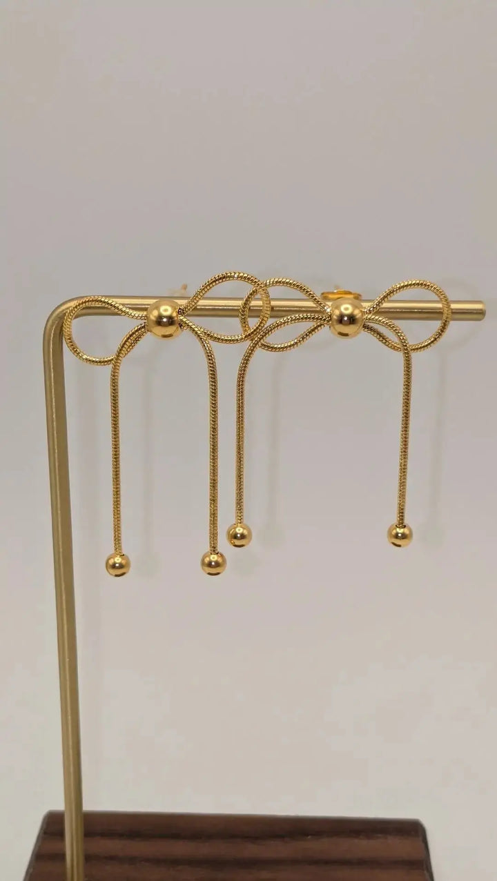 Gold Bow Dangle Earrings Nash Grey