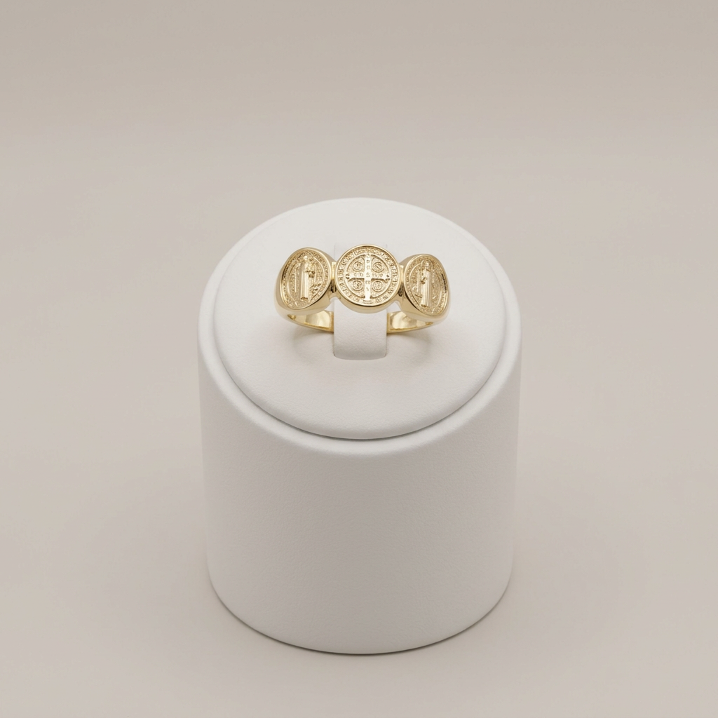 Triple Saint Benedict ring on a white ring holder