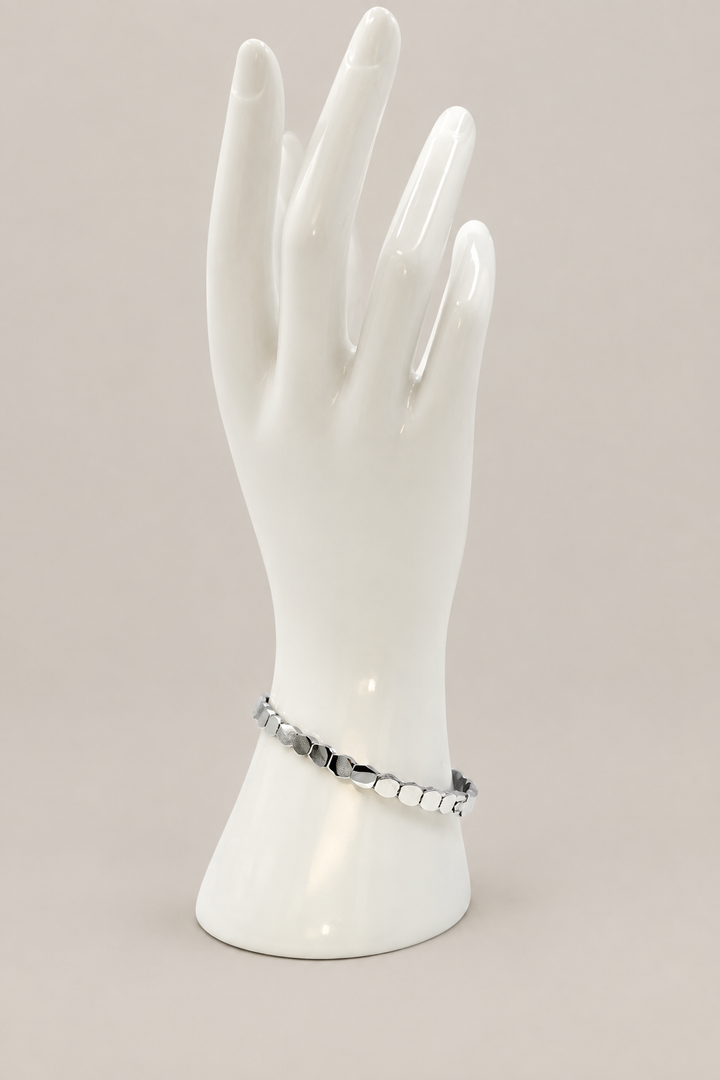 Twisted Chain Bracelet with a matching warm-gray background